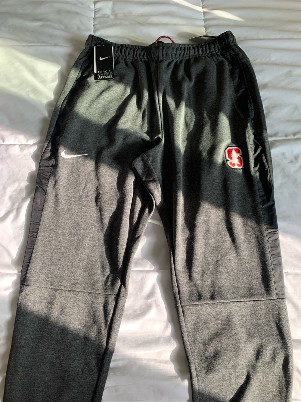 Nike Kids Black Joggers with White Swoosh and Red Crest